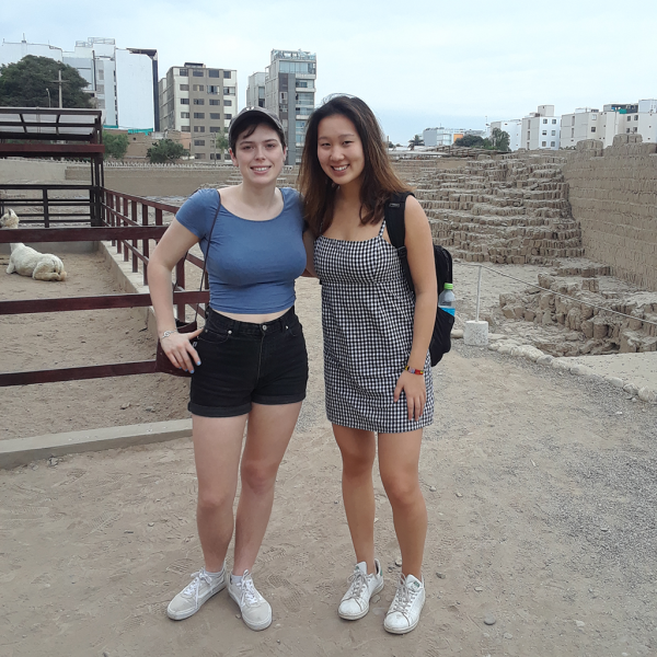 Carolyn and Jodi Ann pose in front of ruins.