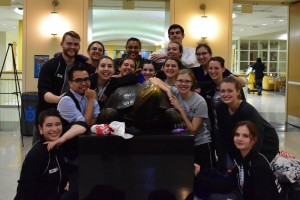 Ballroom dance competitors pose after a recent competition.